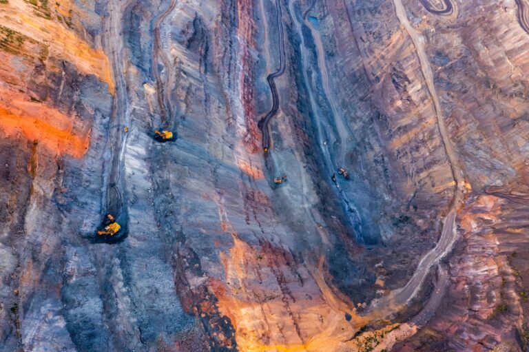 aerial view of an open pit of iron ore resource mining 768x511 - Team